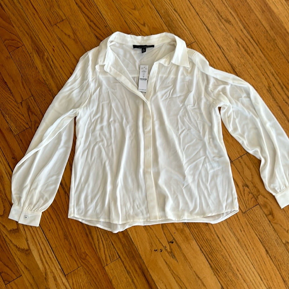 White House Black Market cream button-down blouse in size M